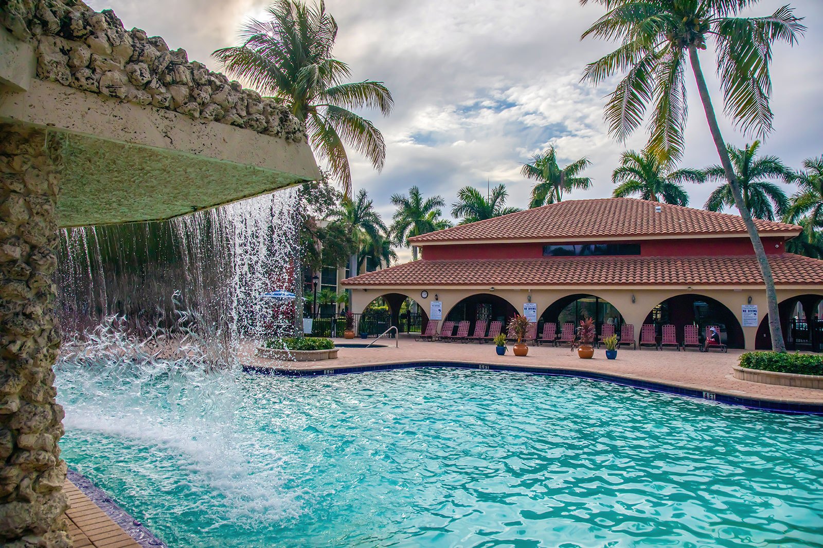 pool area with waterfall at Transitions Recovery Programs Miami drug rehab center