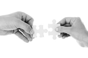 fitting together puzzle pieces
