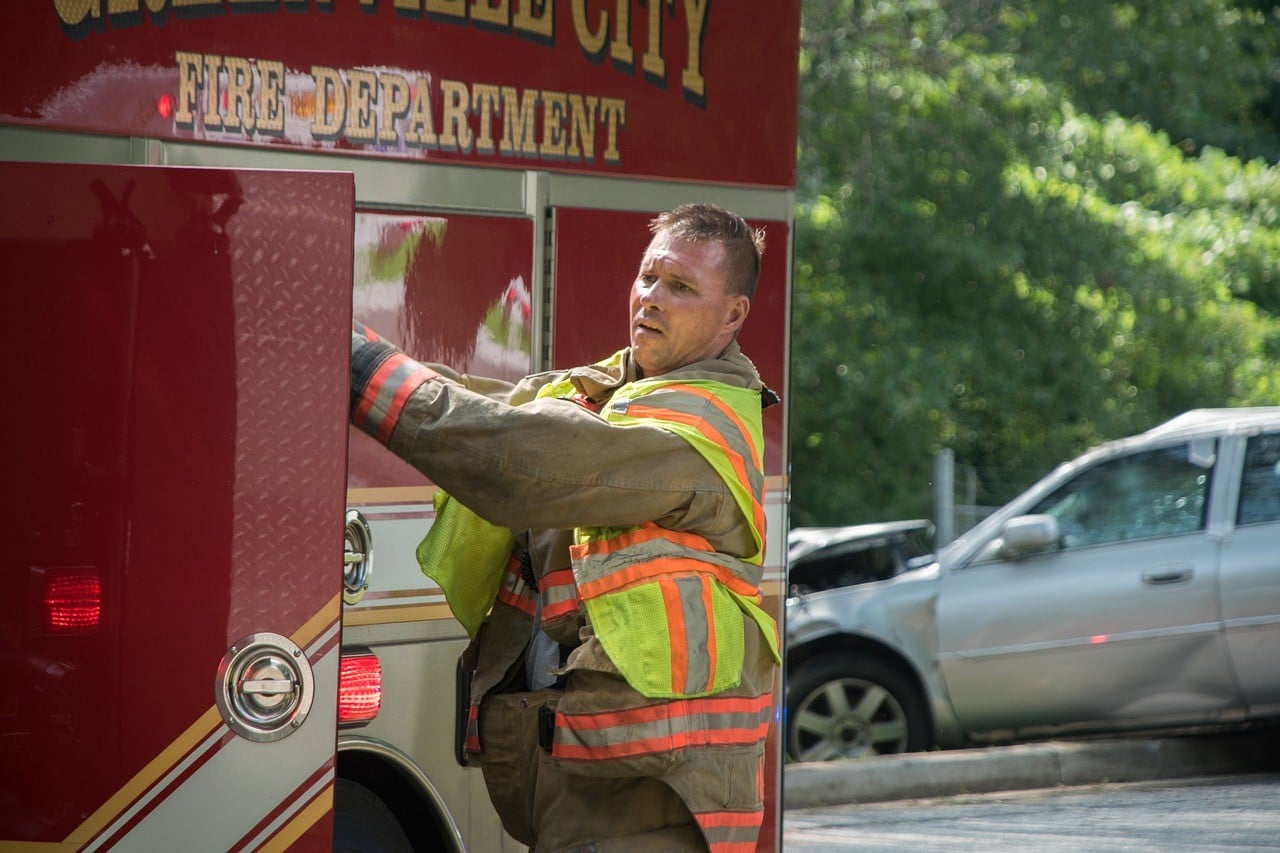 firefighter loading fire truck